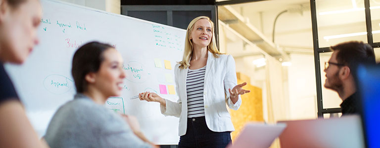 woman leading group at ucla luskin conference center