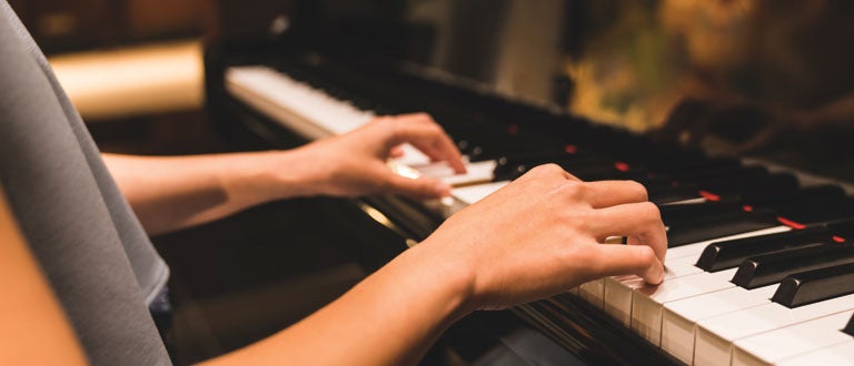 A student plays the piano